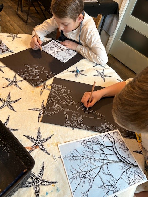 Students working on art projects at the Atelier